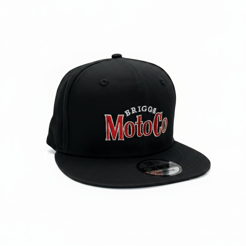 Black cap with 'Briggs MotoCo' logo on a white surface