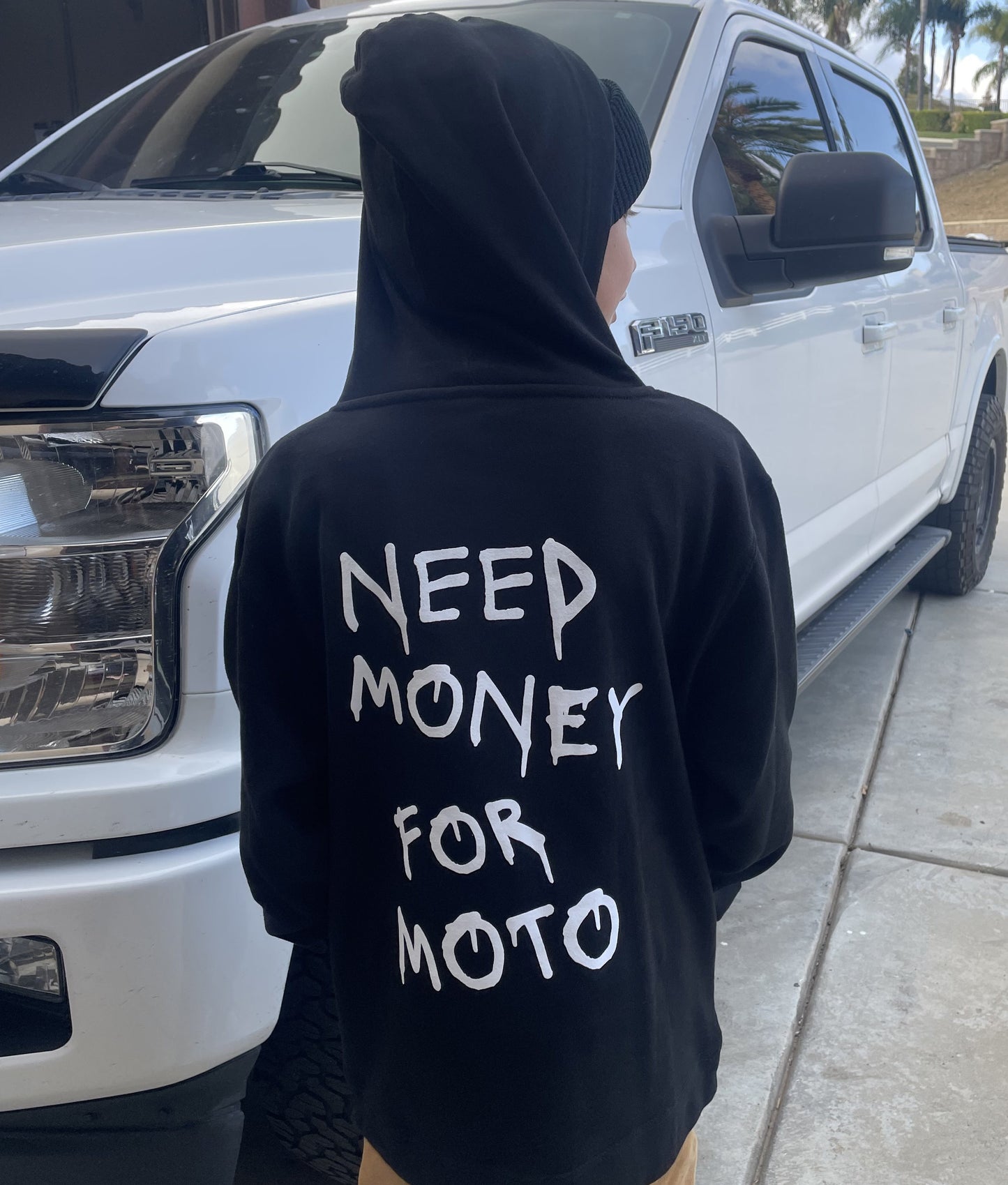 Need Money for Moto Black Youth Hoodie Sweatshirt for Moto Kids. Features White font spray paint style font "Need Money For Moto" large on the rear of the sweatshirt.